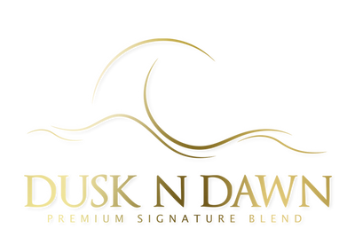 Logo of 'Dusk N Dawn' with a gold design on a white background